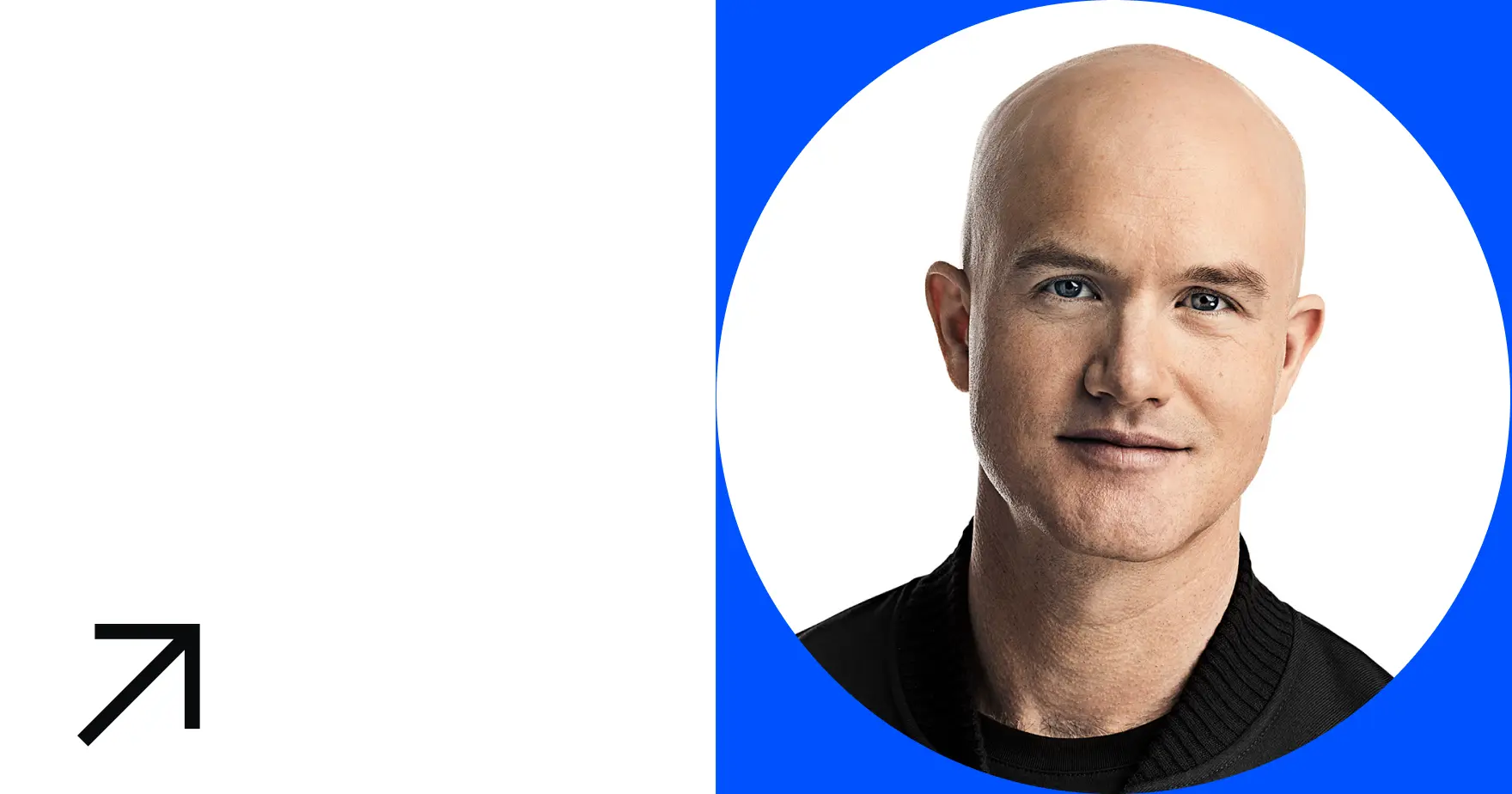 Portrait of a man with a shaved head, wearing a black sweater, against a blue background.