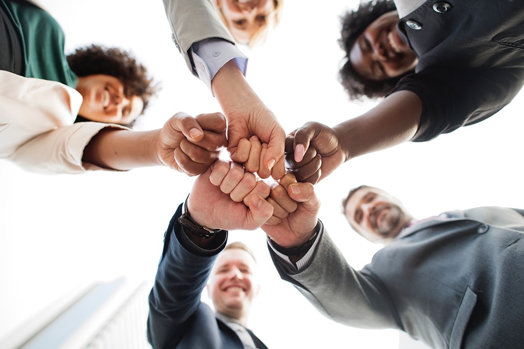 https://www.pexels.com/photo/photo-of-people-doing-fist-bump-1811991/