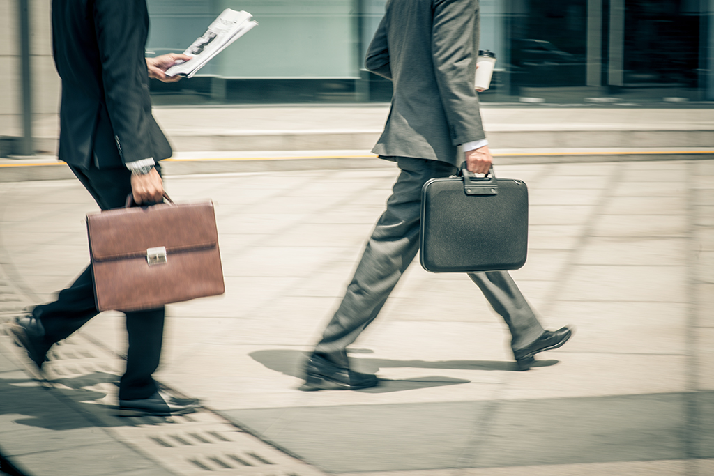 Who are Those Two Men Carrying Tote Bags with ‘Bitcoins’ Past Deutsche Bank?