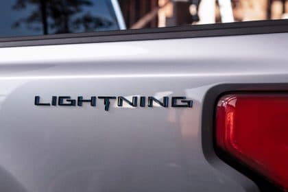 F Stock Slightly Down, Ford Reveals New Electric F-150 Lightning Pickup during Biden’s Visit
