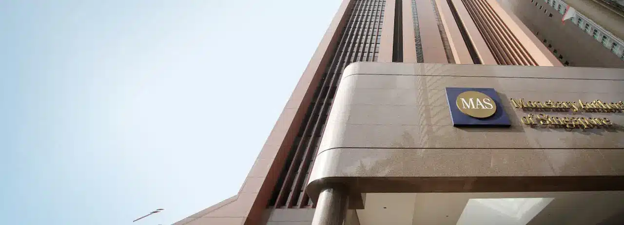 Low angle shot of the Monetary Authority of Singapore building entrance with the MAS logo